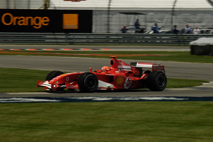 red racecar at Indianapolis Motor Speedway racetrack