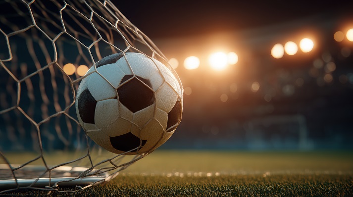 A striking soccer ball les in the net after a goal