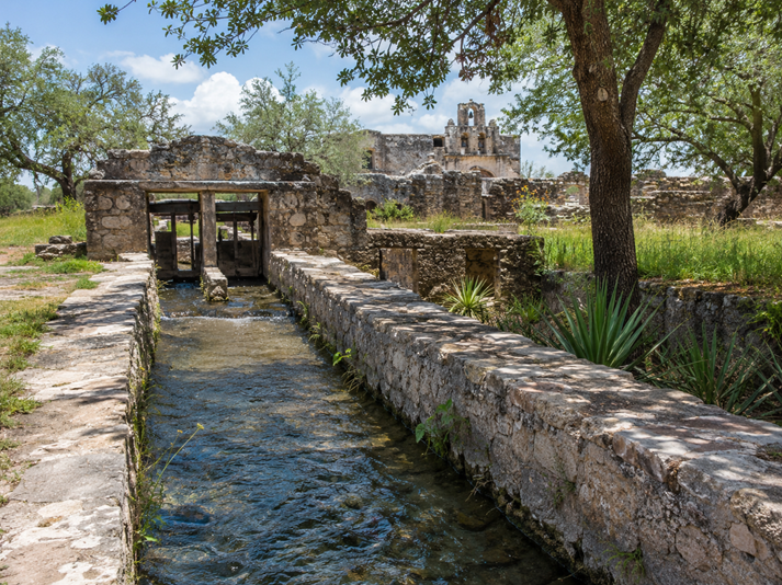 Historic ruins with stone water canal
