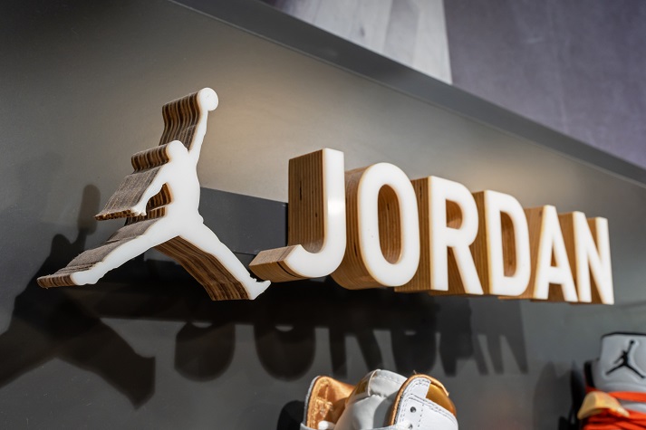 Jordan brand logo on a stand with shoes in a Nike store. Air Jordan is a line of basketball shoes produced by Nike, Inc. Minsk, Belarus - June 12, 2024
