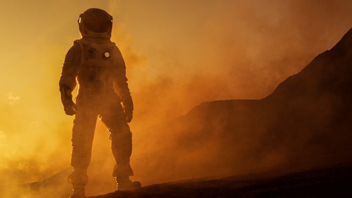 Brave Astronaut Confidently Walks on Mars Surface. Red Planet Covered in Gas and rock, Overcoming Difficulties, Important Moment for the Human Race.