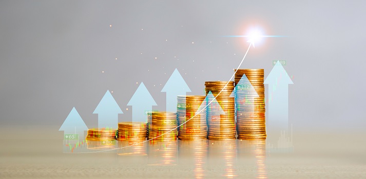 growing money Gold Coins are laid out in graph Arrows shooting up. Growing power of compound interest concept.