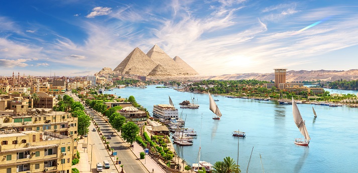 Nile River Aswan downtown with sailboats, panoramic view on the Nile, Egypt