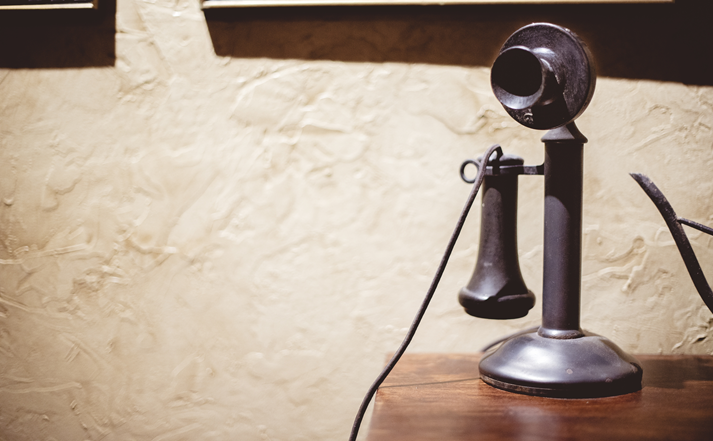 Vintage telephone on a wooden surface