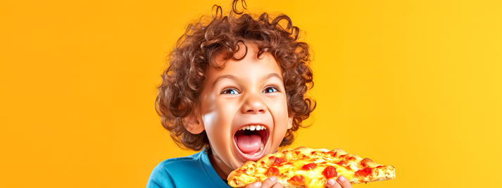 kid eating pizza with a happy expression on his face, yellow banner
