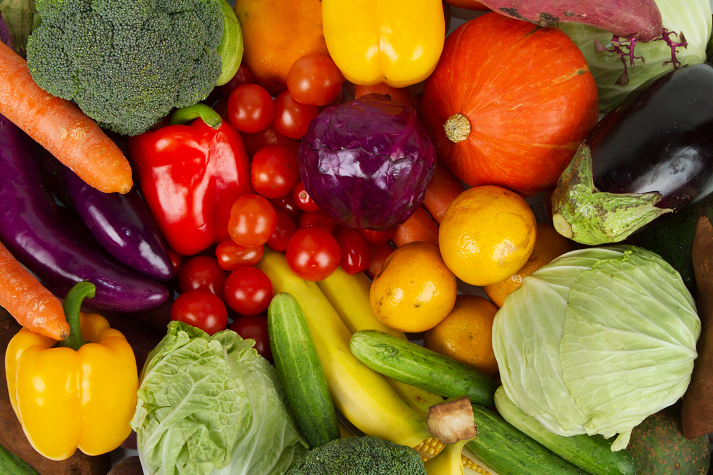 various fruits and vegetables mixed together at a market