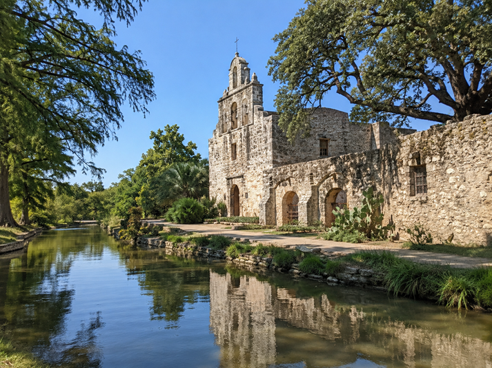 Historic mission by the tranquil river