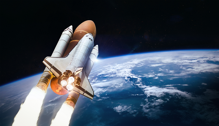 Space shuttle launch in outer space from Earth.
