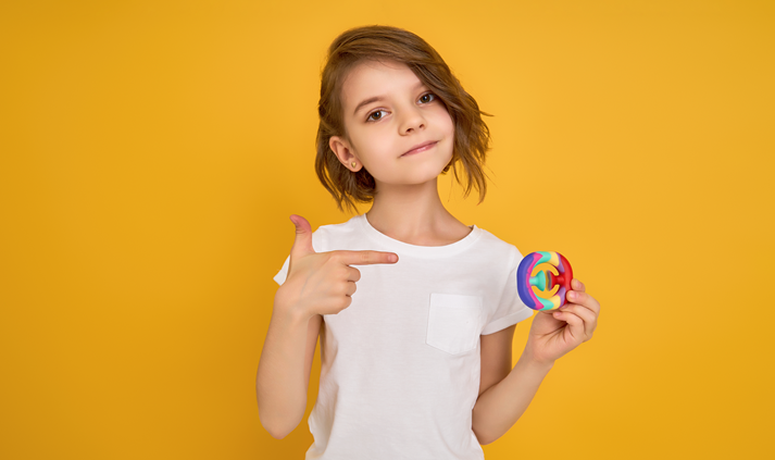 girl holding a fidget toy