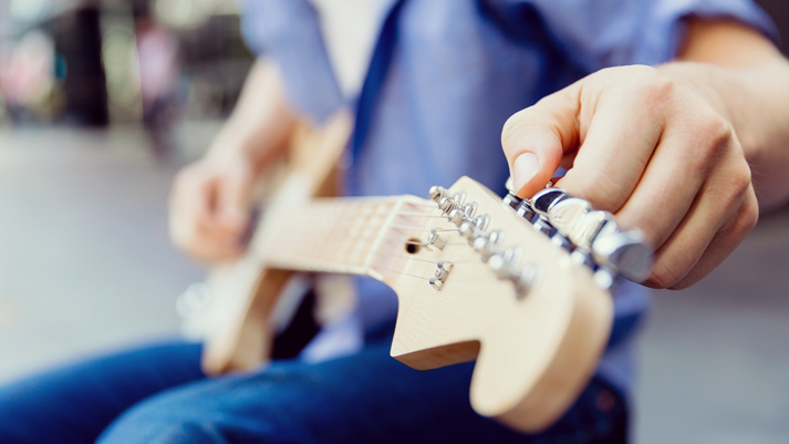 Hands of musician with guitar