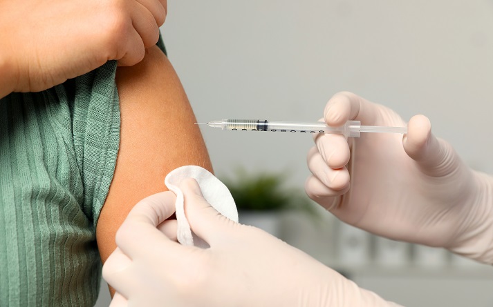 vaccine nurse giving a vaccine