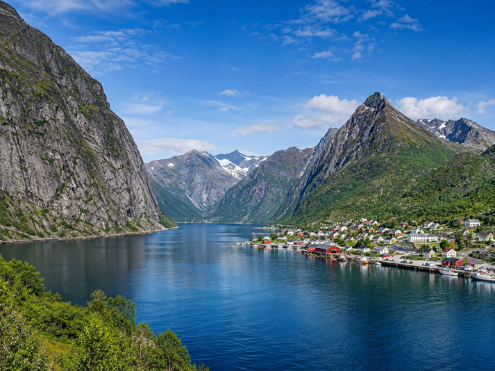 Scenic fjord village under blue skies