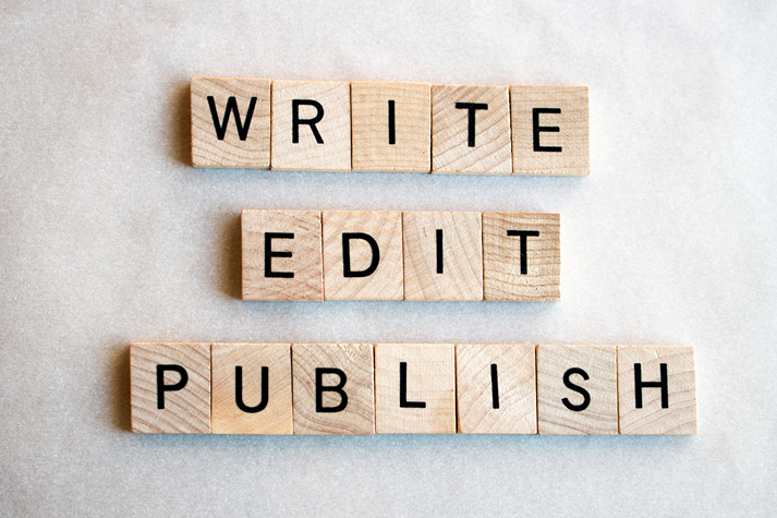 The words write edit publish written in wooden block letters on a white background.